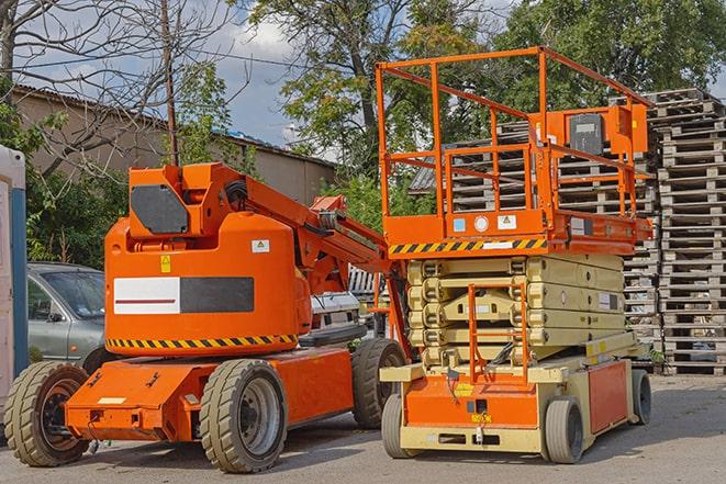 forklift moving pallets of inventory in a warehouse in Alcoa